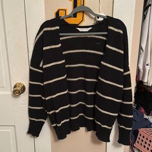 stripped cream and black cardigan.